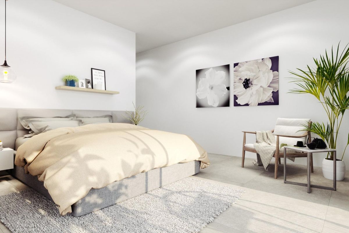 Gezellige slaapkamer in een villa met 4 slaapkamers in Rojales, Costa Blanca, met warme kleuren en uitzicht op buiten.