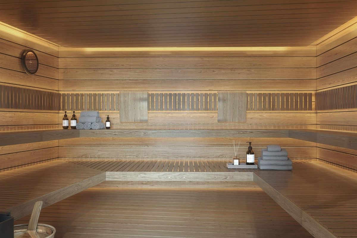 Ontspannen sauna met houten banken en sfeervolle verlichting, beschikbaar in Málaga, Costa del Sol.