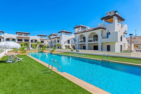 Exterior view of a modern complex with a swimming pool and landscaping in Rojales, Costa Blanca South.