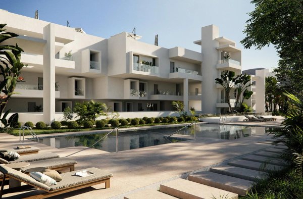 Buitenzicht op een modern appartementencomplex met een zwembad en een aangelegde tuin in Casares, Costa del Sol.
