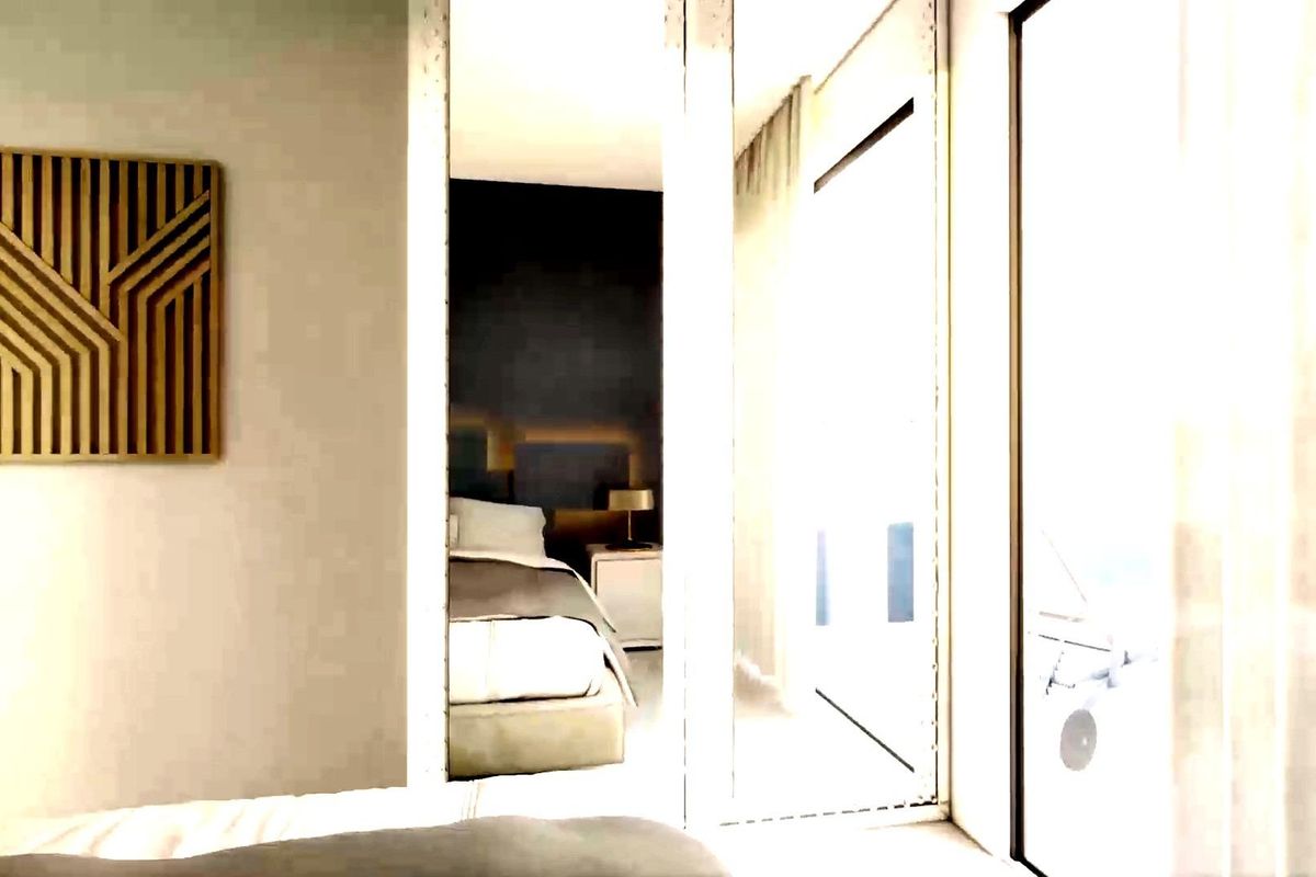 Goed verlichte kijk vanuit de slaapkamer naar de woonruimte, showcasing ontwerpelementen in een appartement op de begane grond in Torrevieja.