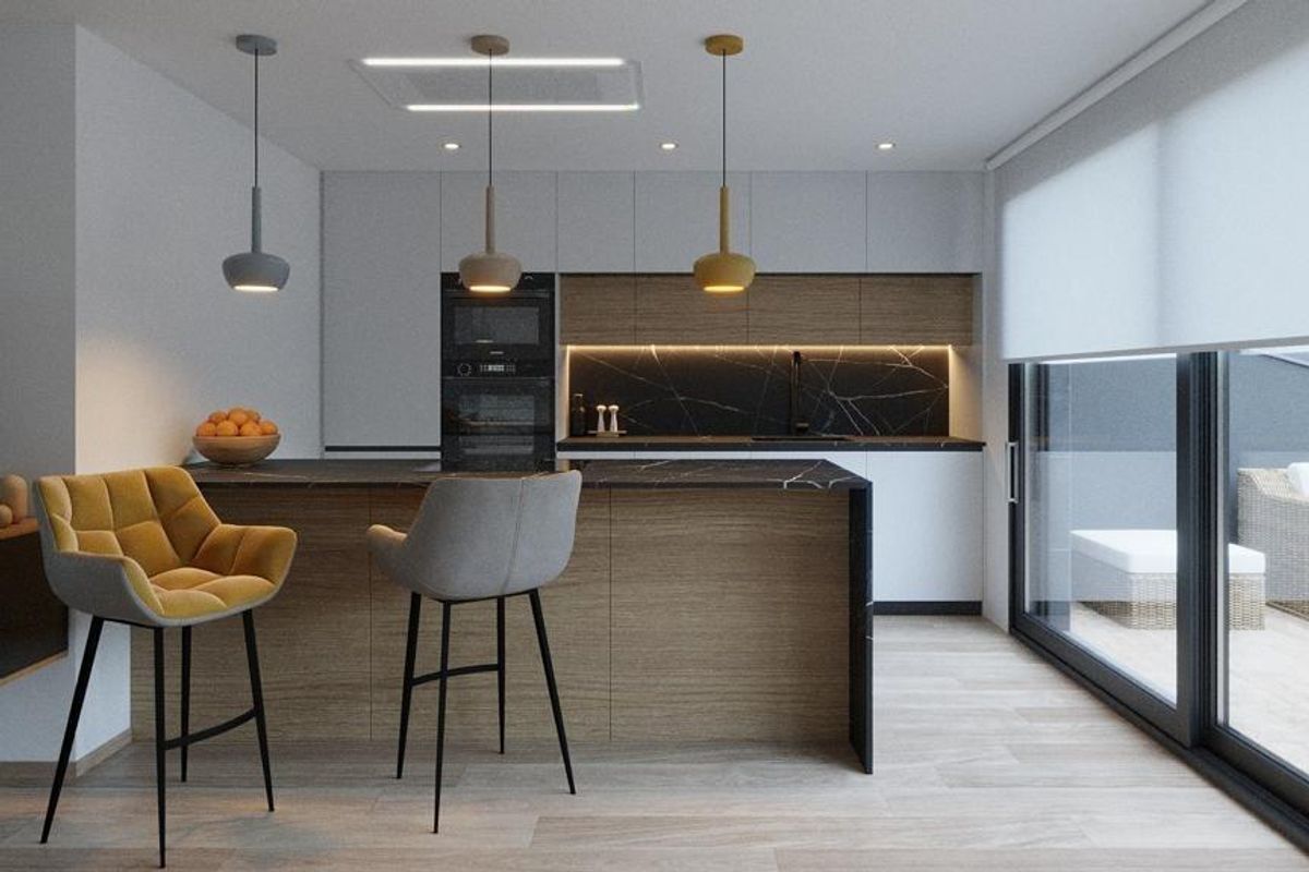 Stijlvolle keuken in het appartement in Finestrat met moderne apparaten en een ontbijtbar.