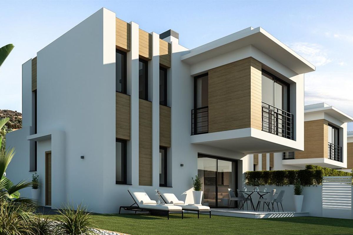 Stijlvolle zijaanzicht van de 3-slaapkamer villa in Denia, met nadruk op het moderne ontwerp en groen.