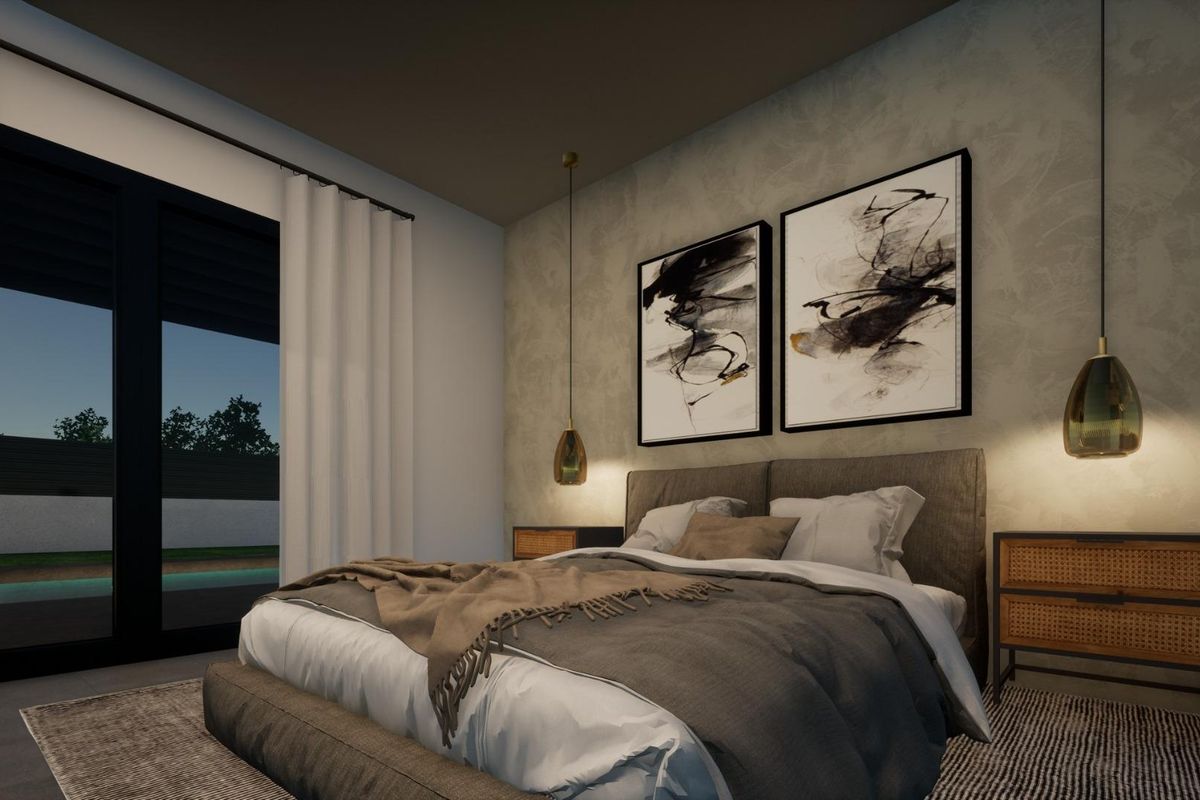 Cozy bedroom in a Pinoso 3-bed villa, designed with warm lighting and artistic accents for comfort.