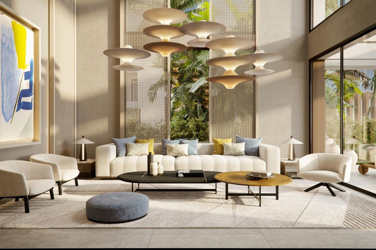 Chic loungegebied in de villa met zachte meubels en een serene ambiance, met uitzicht op de tuin.