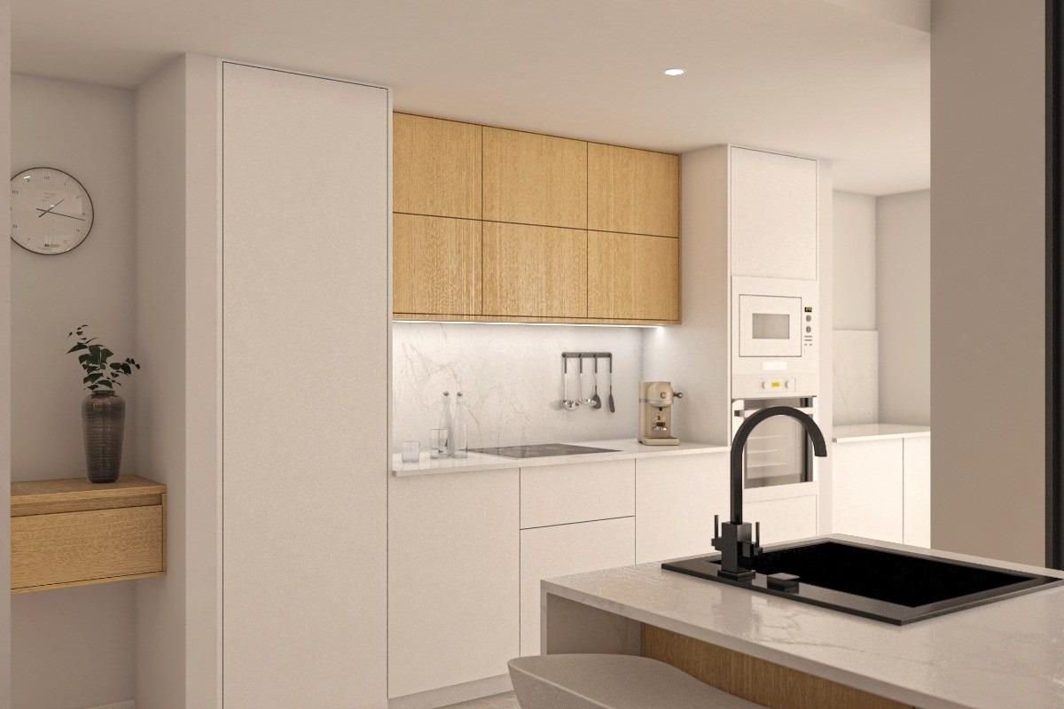 Slank keukenontwerp met moderne apparatuur in het appartement op de begane grond in San Pedro del Pinatar.