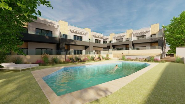 Appartementcomplex op de begane grond met een zwembad in Bigastro, Costa Blanca Zuid, Spanje. Levendig tuingebied zichtbaar.