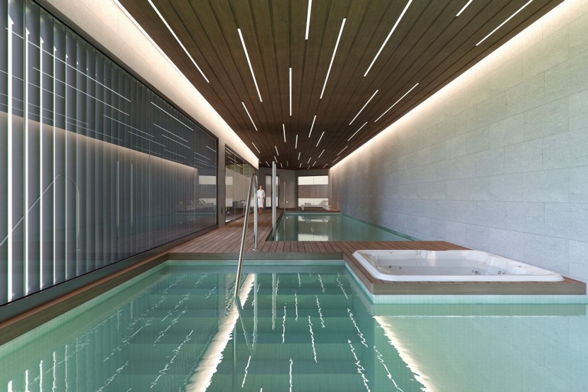 Stijlvolle binnenpool in een 3-slaapkamer appartementcomplex in Orihuela Costa, met moderne verlichting.