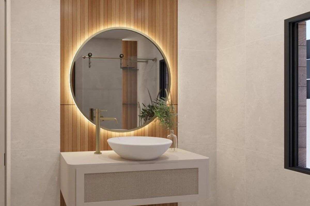 Modern bathroom with chic fittings and a round mirror in a Pinoso 3-bed villa.