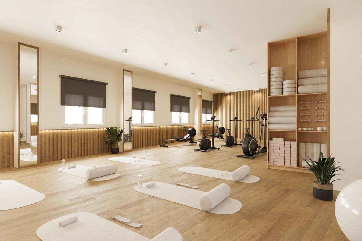 Goed uitgeruste gym met fitnessapparatuur en yogamatten, gelegen in het appartementcomplex in Aguilas.