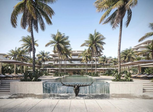 Luxe poolgebied met palmbomen in een modern complex in Estepona, Costa del Sol.