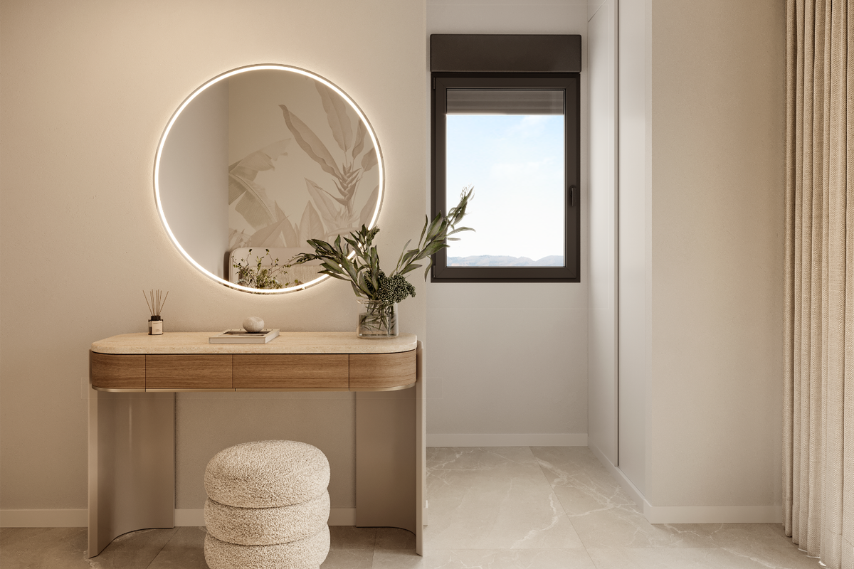 Stijlvolle entree van de penthouse in Finestrat, met een ronde spiegel en natuurlijk licht.