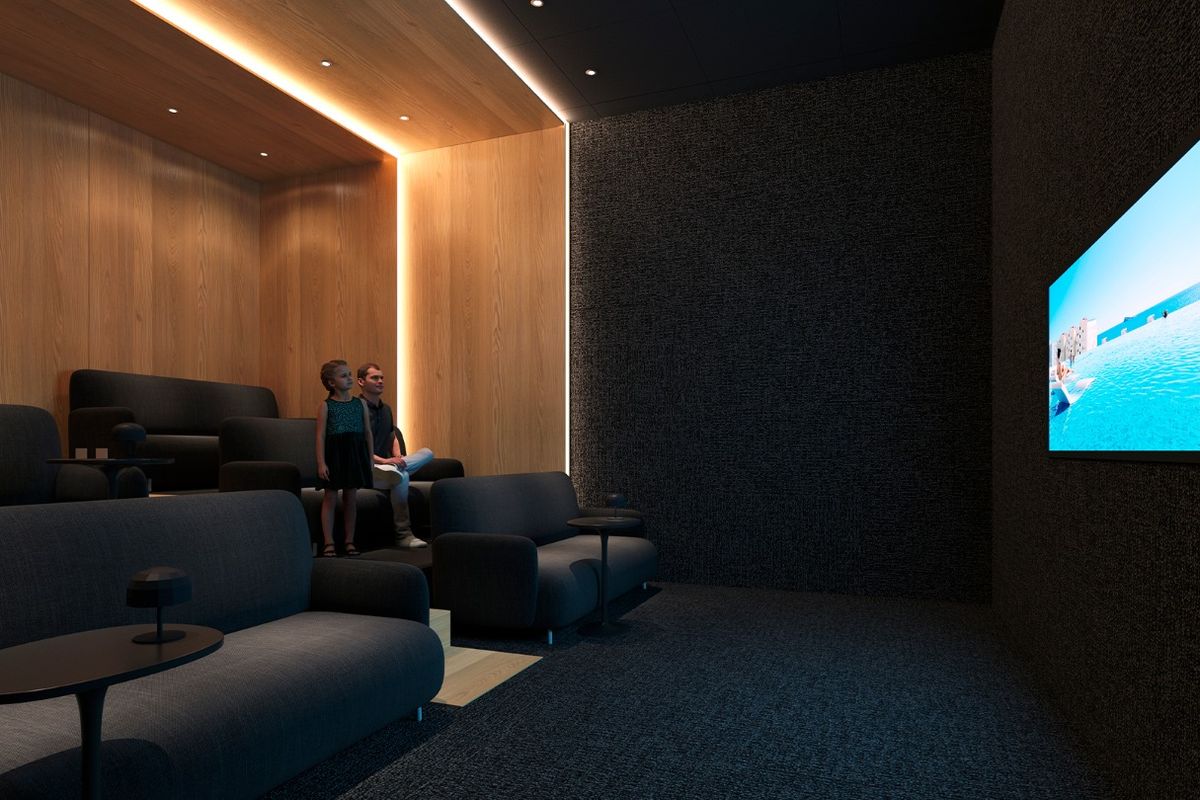 Gezellige thuisbioscoop met donkere inrichting en comfortabele zitplaatsen in een appartement in Benidorm.