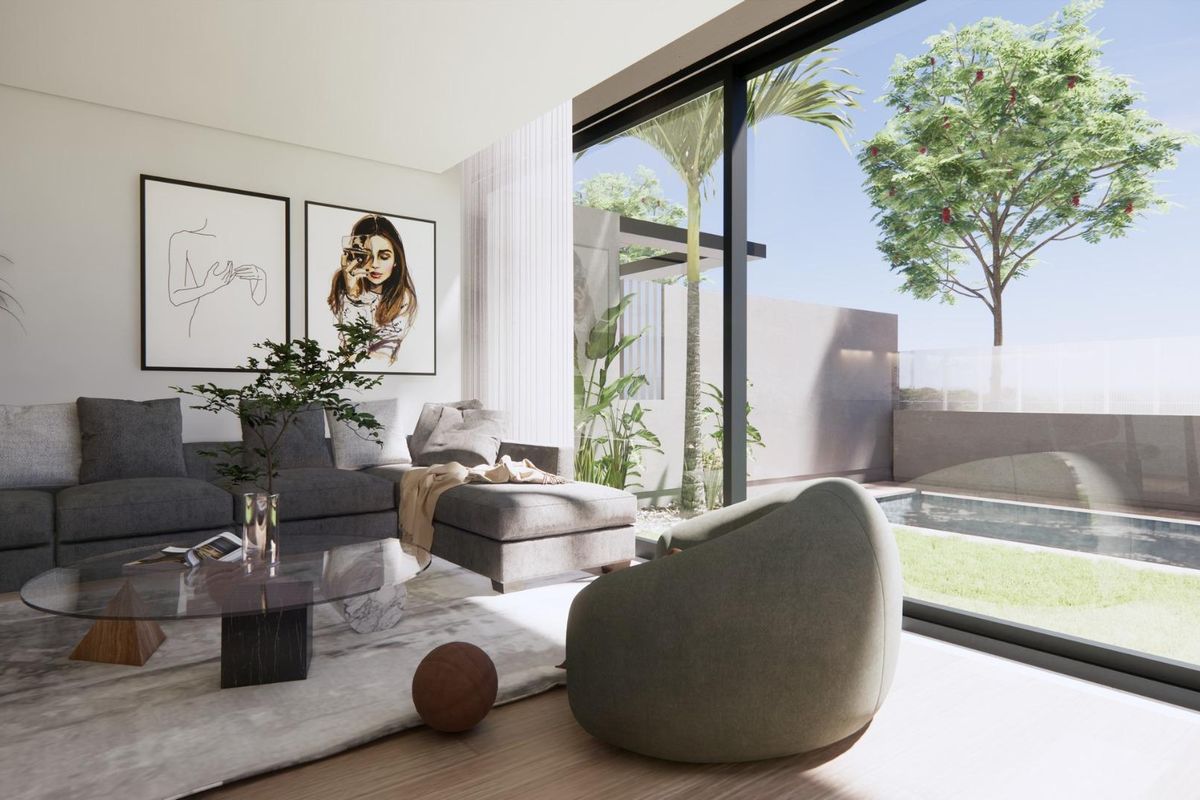 Gezellige hoek van de woonkamer van een villa in Torre Pacheco, met stijlvolle decoratie en toegang tot de tuin.