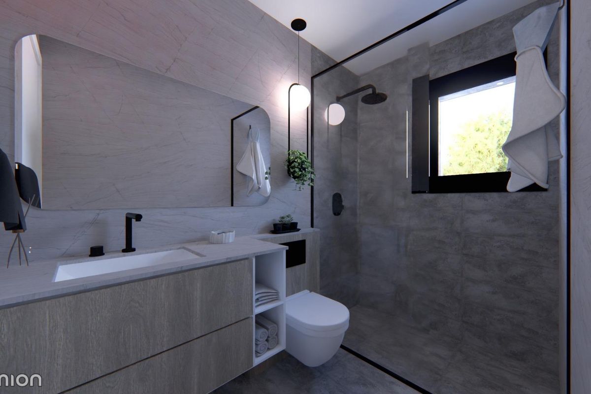 Moderne badkamer in een 3-slaapkamer townhouse in San Javier, met stijlvolle voorzieningen en natuurlijk licht.