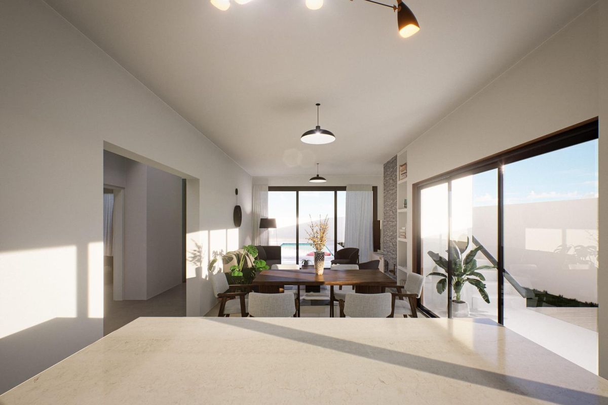 Eetruimte in een 3-slaapkamer villa in Fortuna, Spanje, met grote ramen en uitzichten op buiten.