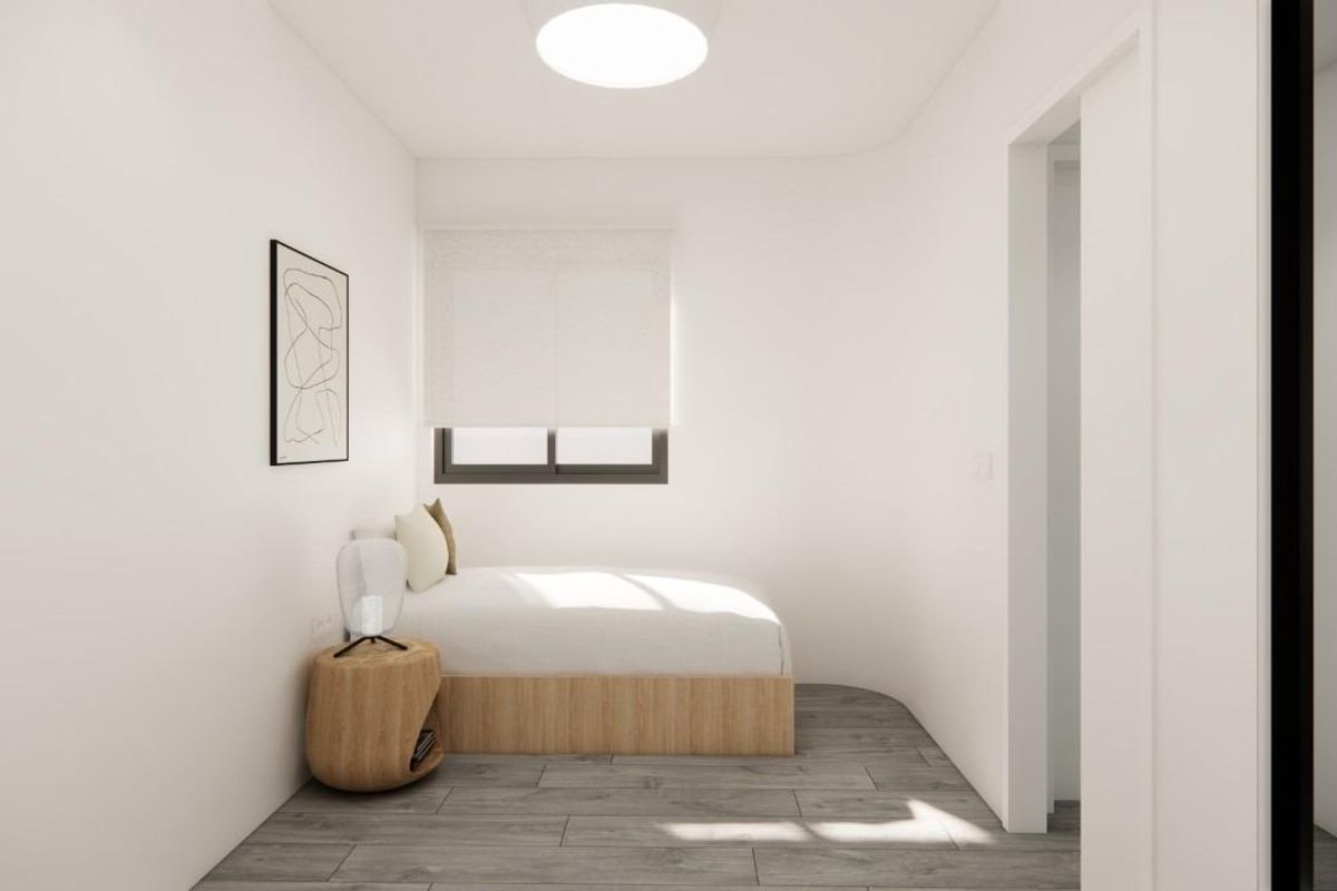 Tweede slaapkamer met een comfortabel bed en minimalistisch design in een 2-slaapkamer penthouse, Pilar de La Horadada, Spanje.