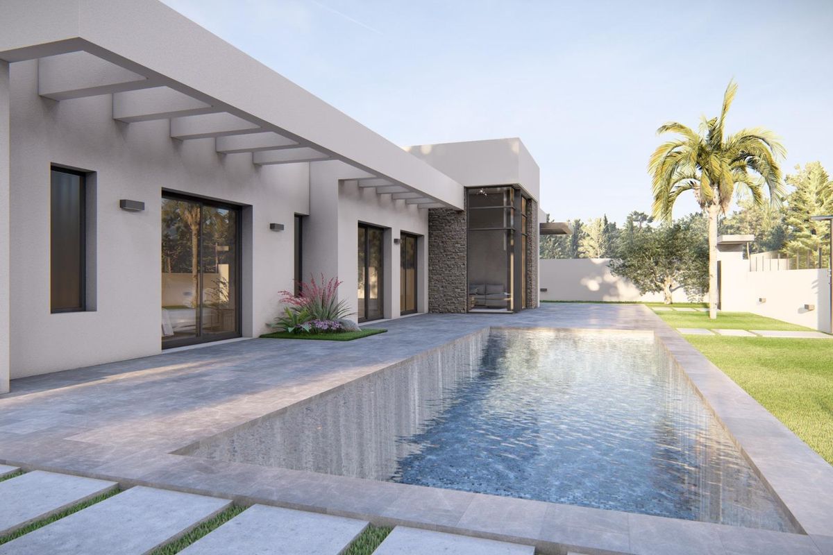 Een ander uitzicht op het zwembadgebied van de 3-slaapkamer villa in Ciudad Quesada, omgeven door groen.