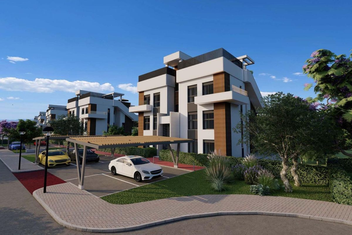 Stijlvol exterieur van de appartementen met groen en auto's in Fuente Álamo, Costa Calida.