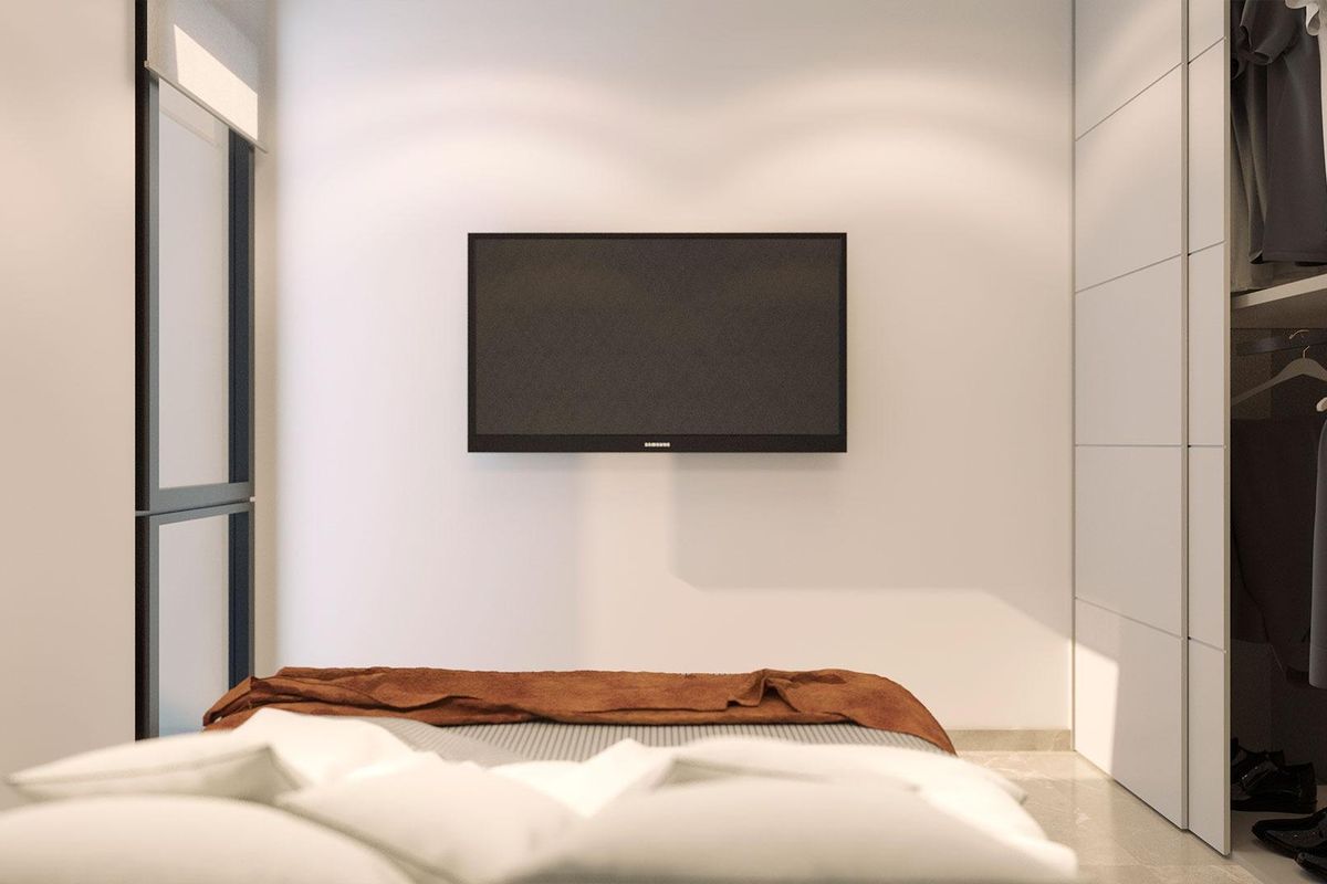 Strakke slaapkamer in een een-slaapkamer appartement in Torrevieja, met een gezellig bed en kast.