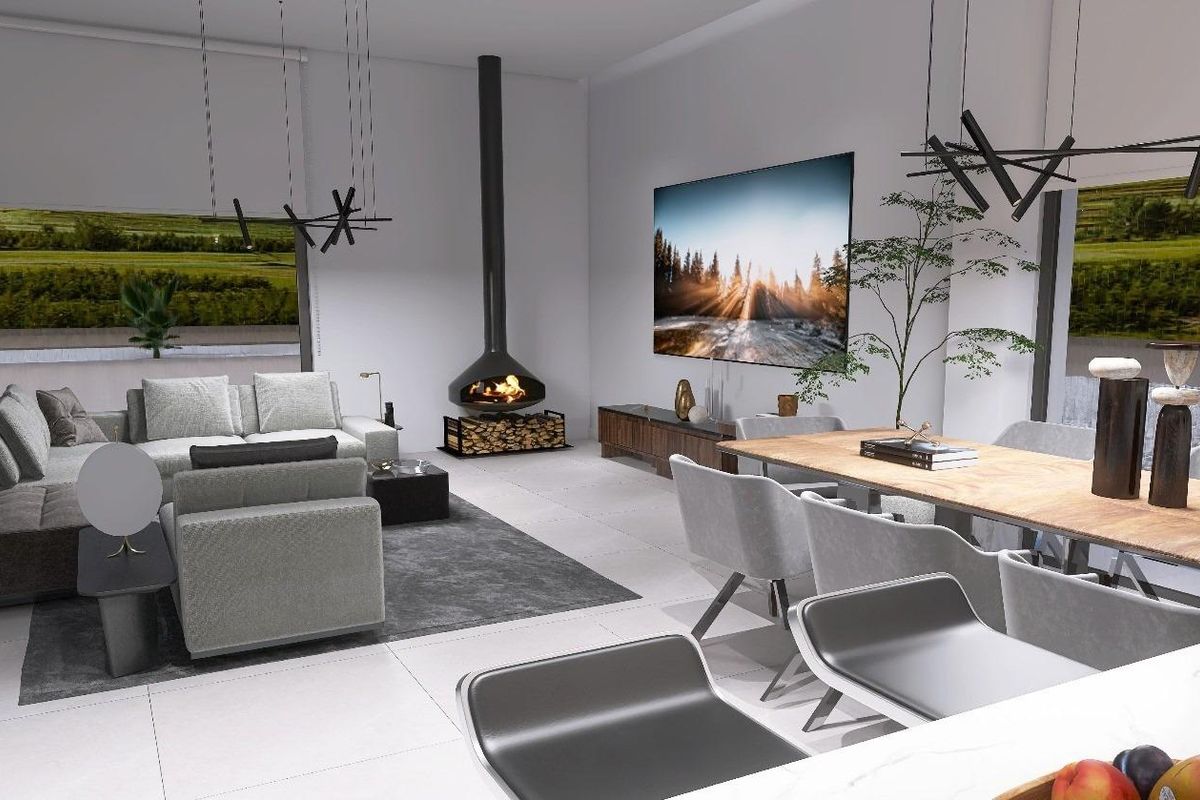 Gezellige woonkamer in de villa met een open haard en prachtig landschapsschilderijen aan de muren.