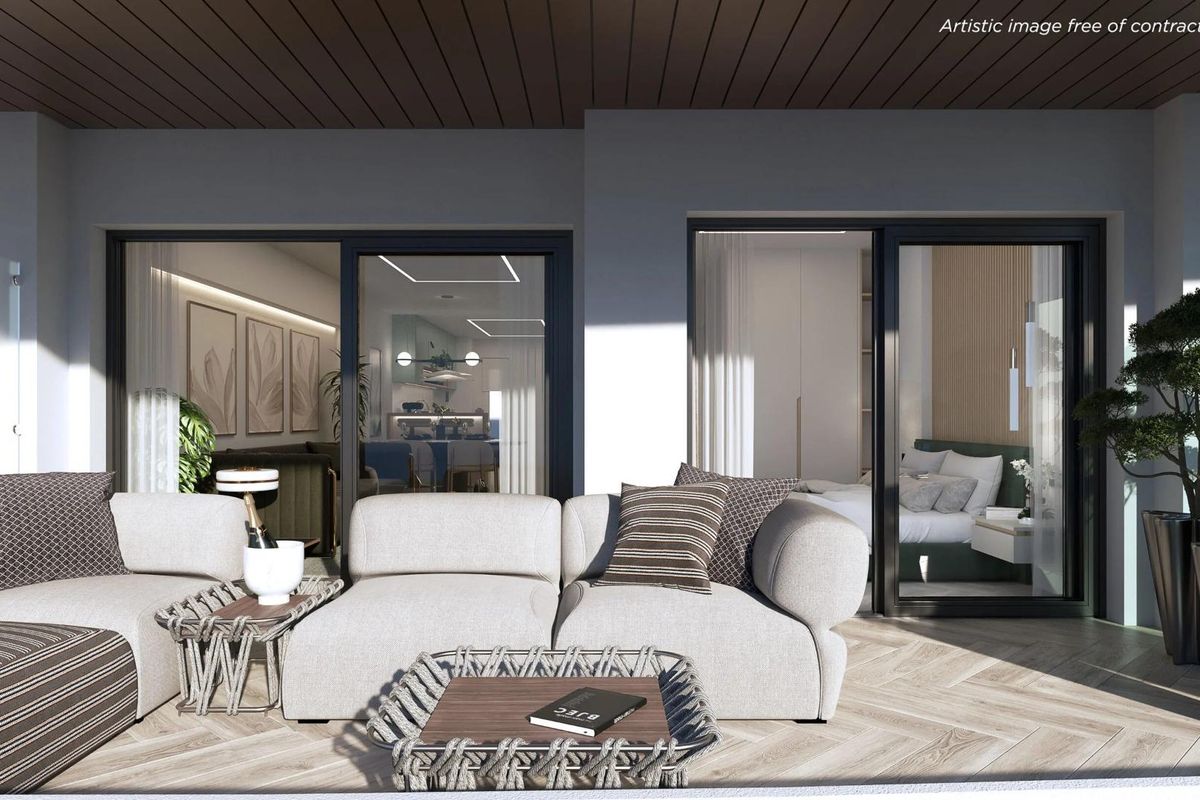 Spacious terrace with lounge seating in a contemporary 2-bed apartment, La Manga del Mar Menor.