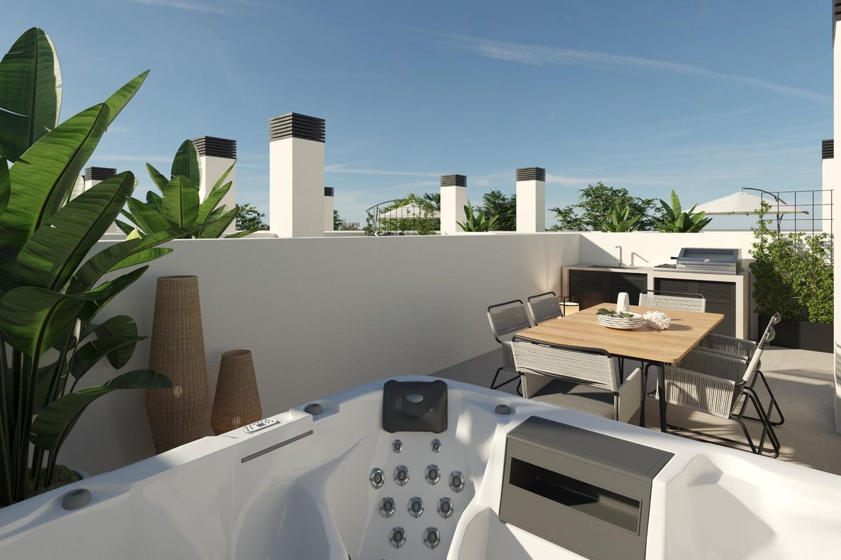 Rooftop terrace in a 3-bed townhouse in Dolores, Costa Blanca South. Features a jacuzzi, outdoor kitchen, and dining area.