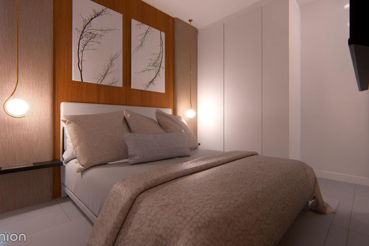 Gezellige slaapkamer met modern decor in een townhouse in San Javier, perfect om te ontspannen met voldoende verlichting.