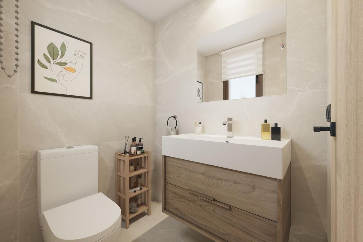 Moderne half-badkamer in een 3-slaapkamer townhouse in Mijas, Costa del Sol, met minimalistisch ontwerp en functionele indeling.