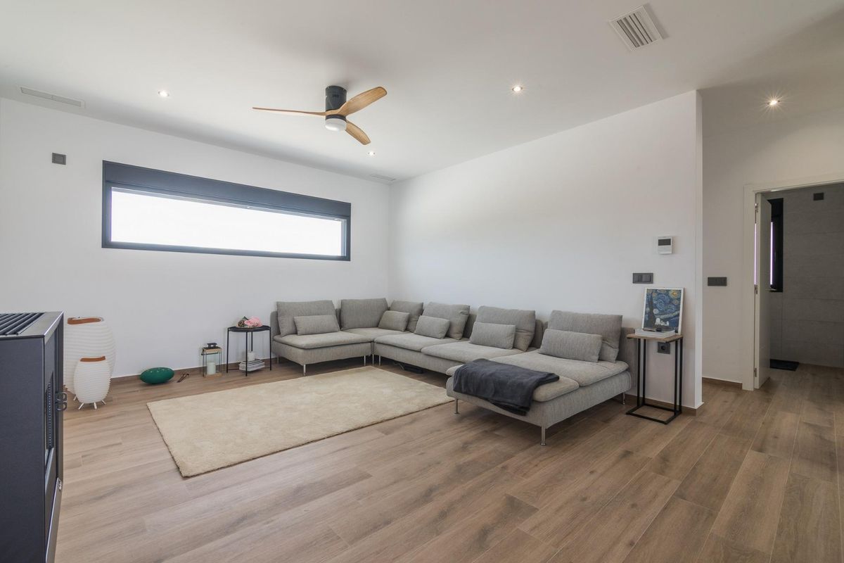 Spacious living area in a 3-bed villa located in Pinoso, featuring a modern sectional sofa.