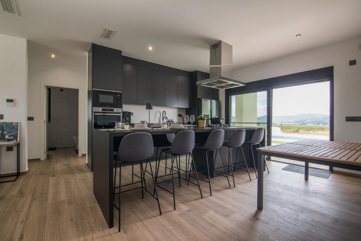 Sleek kitchen with modern amenities in a 3-bedroom villa in Pinoso, perfect for entertaining guests.