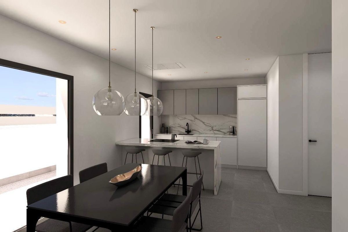 Geavanceerde eetruimte met een strakke keuken in een stijlvolle townhouse in Benijofar, perfect voor bijeenkomsten.