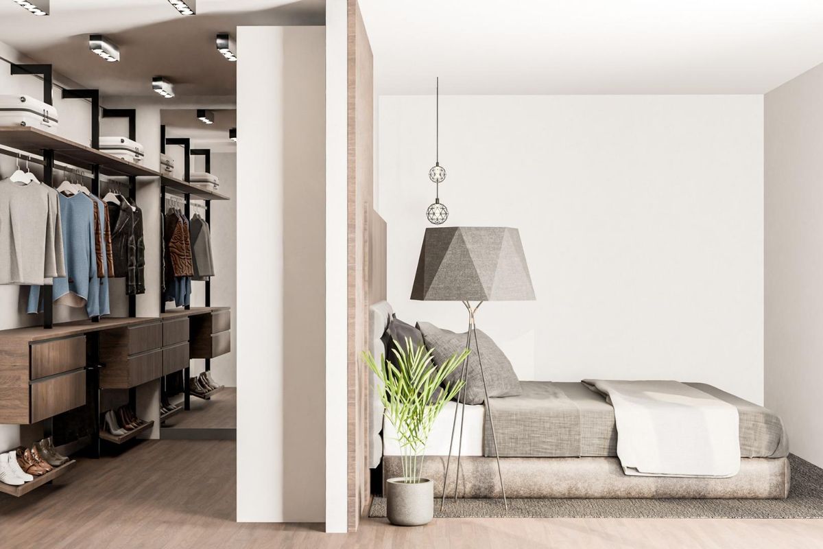 Charming bedroom layout with an organized closet area and cozy furnishings, in a 3-bed villa in Pinoso, Costa Blanca.