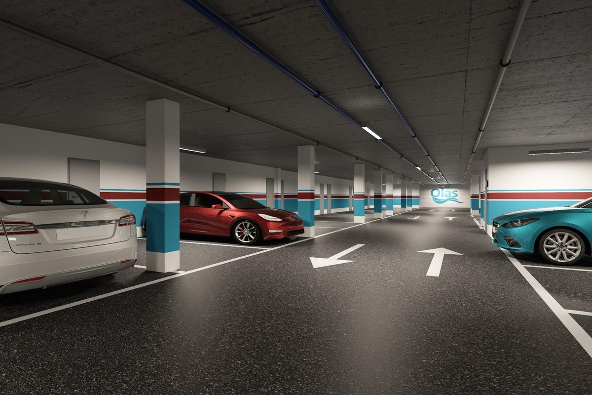 Ondergrondse parkeergarage met rode, witte en blauwe elektrische auto's en parkeermarkeringen
