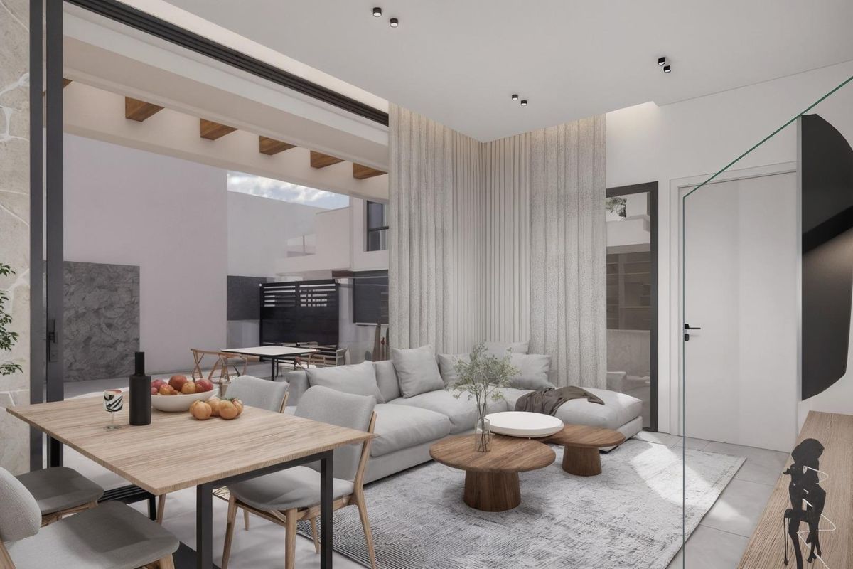 Gezellige woonkamer met comfortabele zitplaatsen en een eettafel, die een uitnodigende sfeer creëert in een 3-slaapkamer villa, Los Montesinos, Spanje.