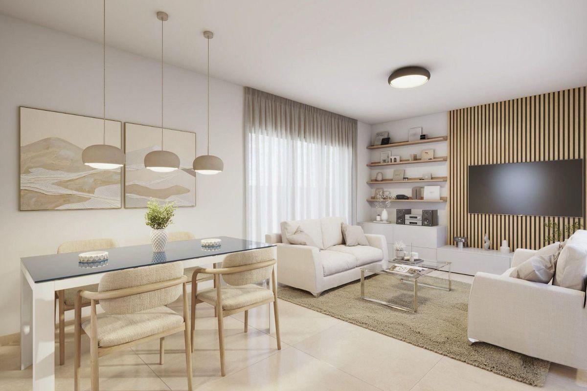 Bright living and dining area in a 3-bed villa in Costa Calida, Spain. Minimalist design with light wood accents.