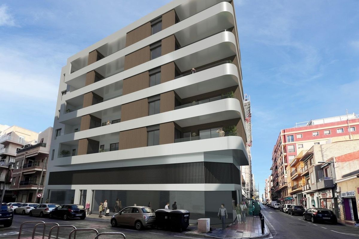 Een ander uitzicht op een modern appartementencomplex in Santa Pola, dat het architectonisch ontwerp benadrukt.