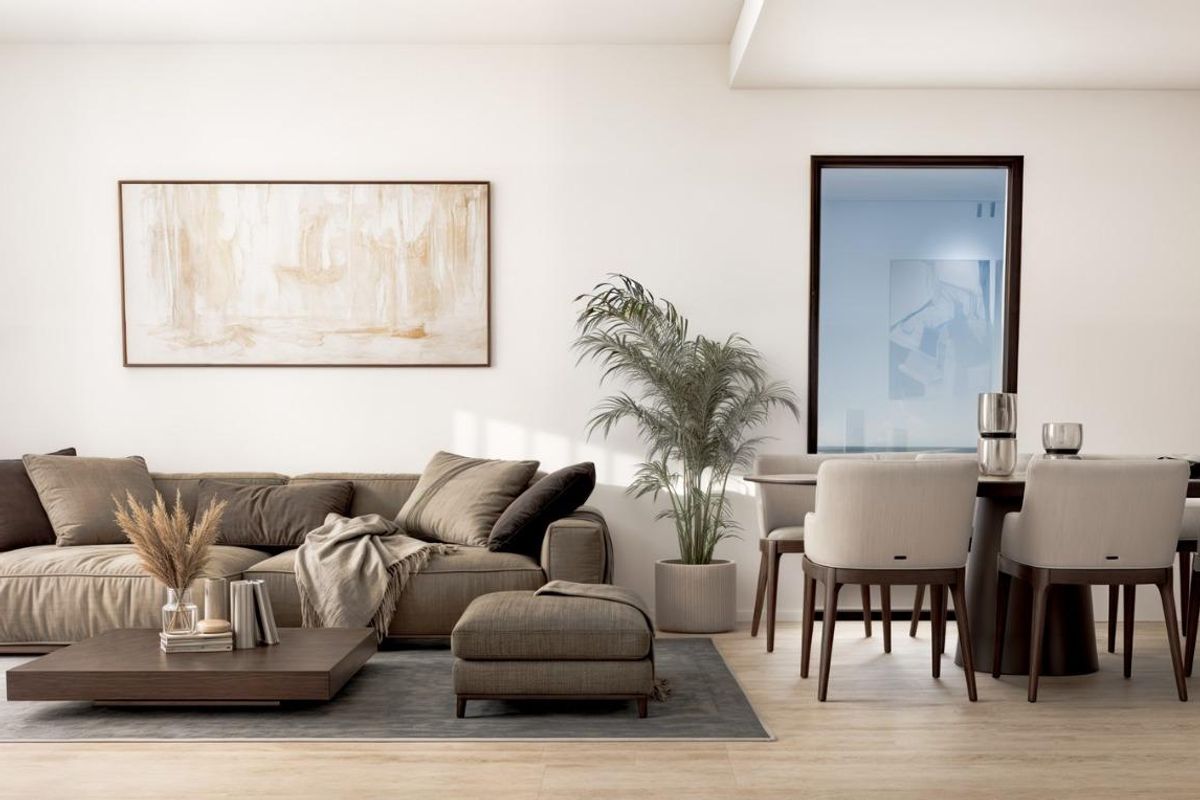 Stijlvolle woonkamer met een gezellige bank en eetruimte in een 2-slaapkamer appartement in Finestrat, Costa Blanca.