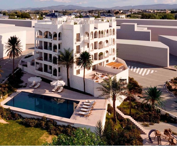 Buitenkant van een modern appartementencomplex met zwembad en aangelegde tuinen in Bigastro, Costa Blanca.