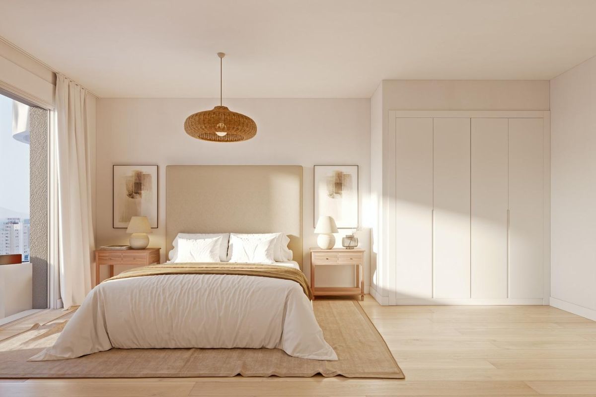 Cozy bedroom featuring modern decor with natural light in a 2-bed apartment in Calpe, Costa Blanca North.