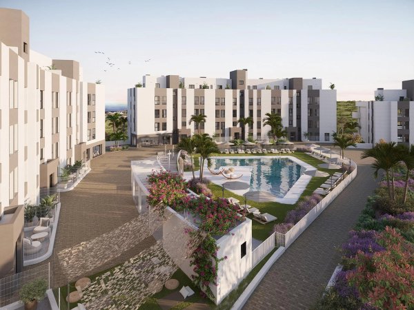Buitenzicht op een modern appartementencomplex met zwembad in Mijas, Costa del Sol.