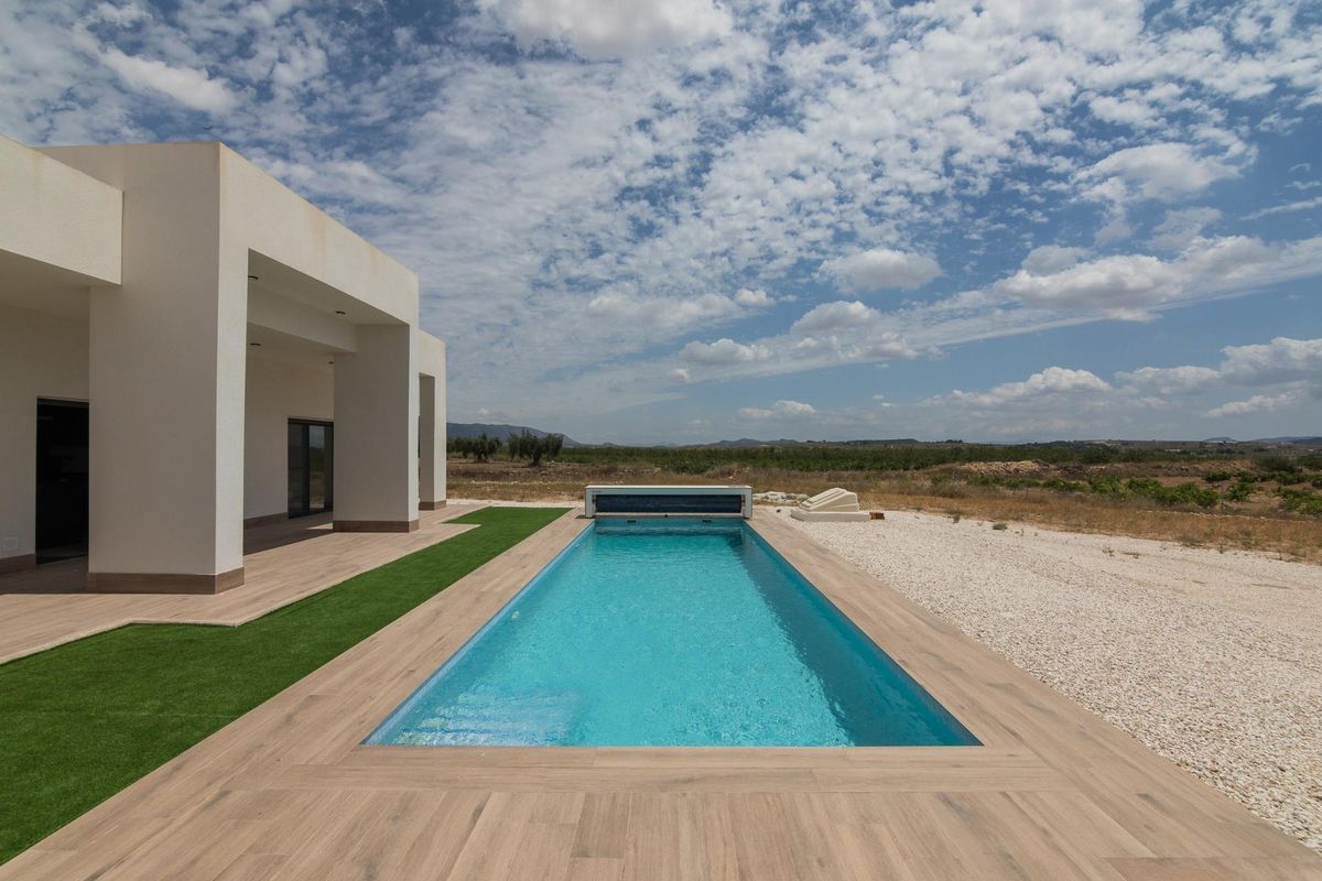 The inviting pool area can be seen alongside the villa in Pinoso, Costa Blanca South.