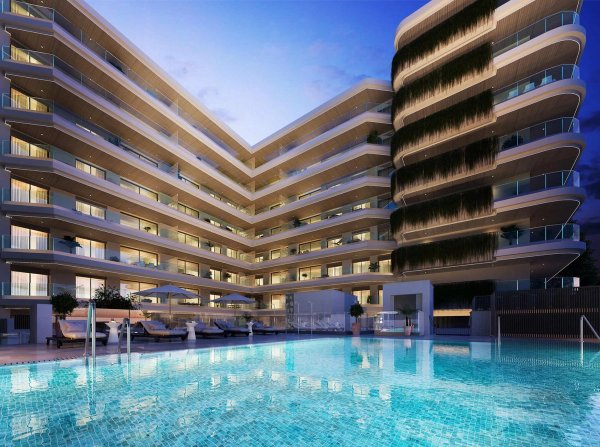 Modern apartment complex with a sparkling pool in Fuengirola, Costa del Sol, Spain.