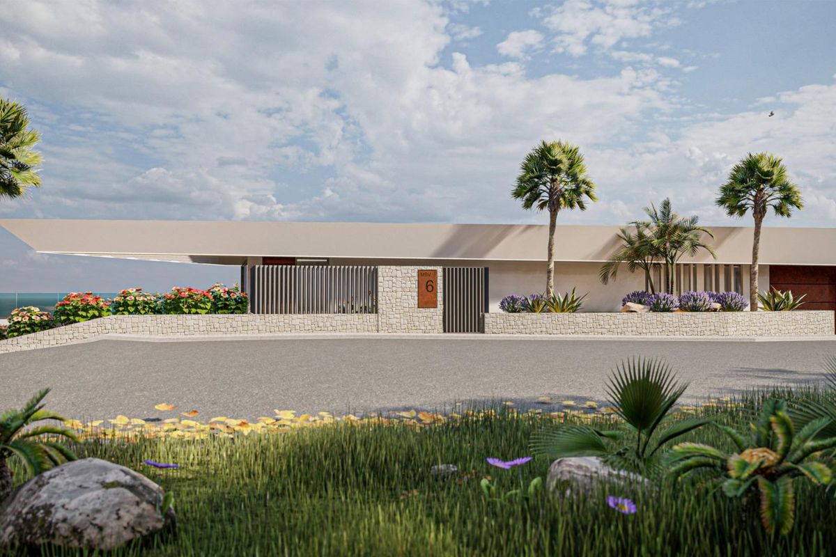 Strakke façade van een hedendaagse villa in Calpe, met een minimalistisch ontwerp en een levendig tuingebied.