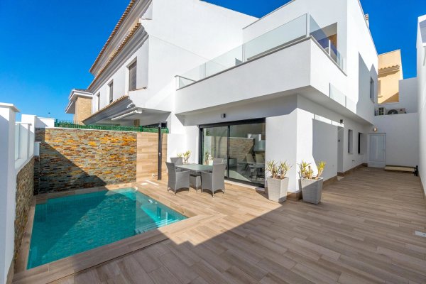 Modern town house terrace with pool and dining area in San Pedro del Pinatar, Costa Calida, Spain.