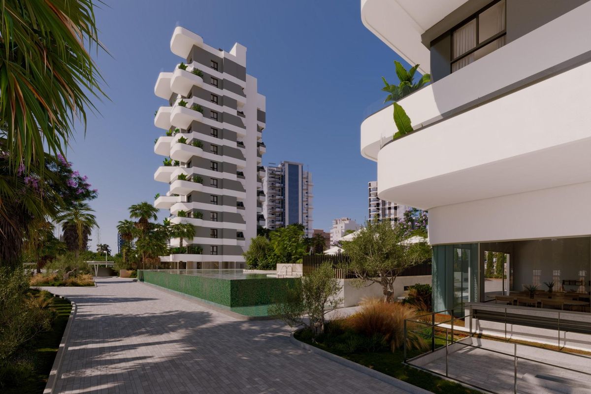 Stylish modern architecture featuring pathways and gardens around an apartment complex in Calpe, Costa Blanca North.