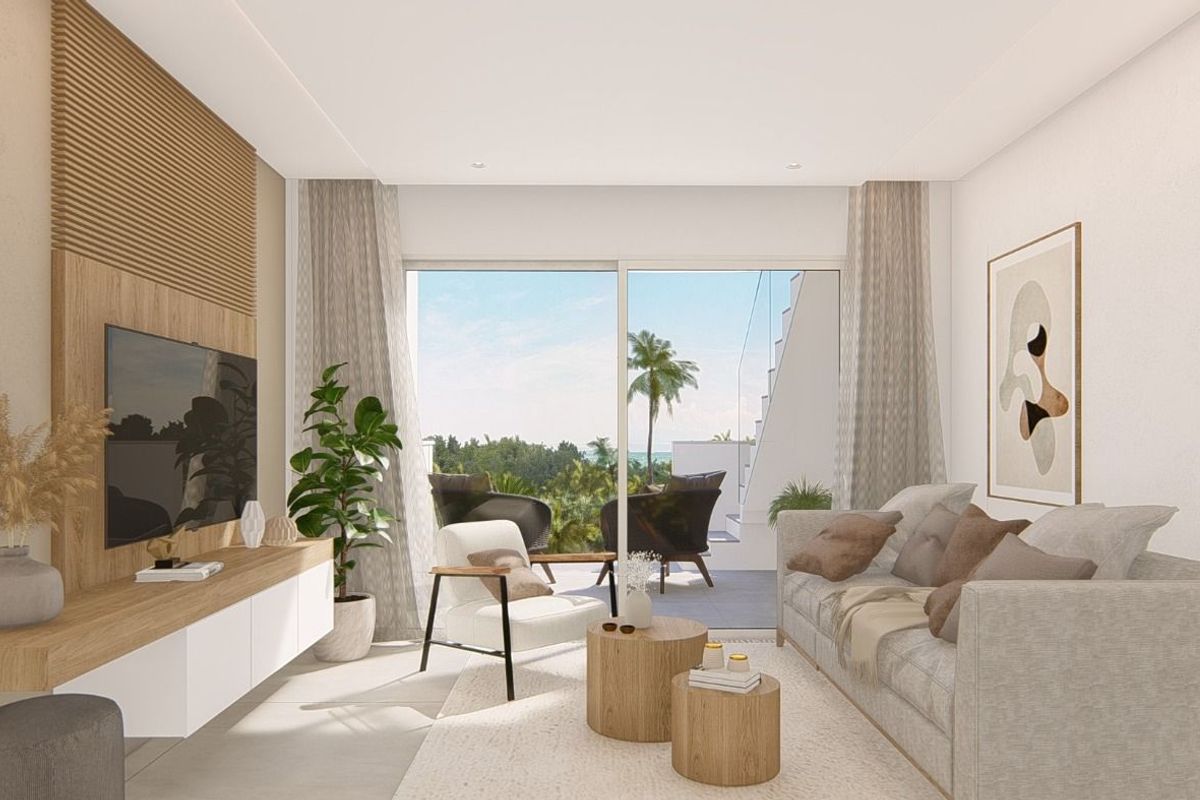 Stylish living room in the apartment, featuring modern decor and views of the outdoor terrace in Guardamar.