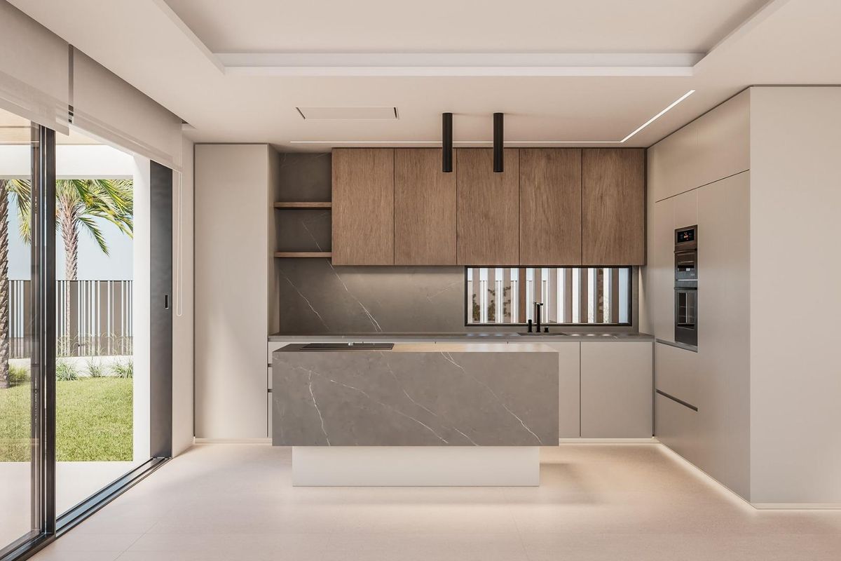 Sleek kitchen view in a 2-bed townhouse in El Campello, with modern cabinets and natural light.