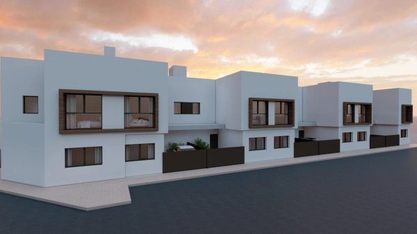 Buitenkant van een moderne 3-slaapkamer townhouse in San Javier, met een strakke uitstraling en grote ramen.