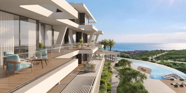 Modern terrace with seating, showcasing ocean views in Casares, Spain’s luxurious 2-bed apartment.